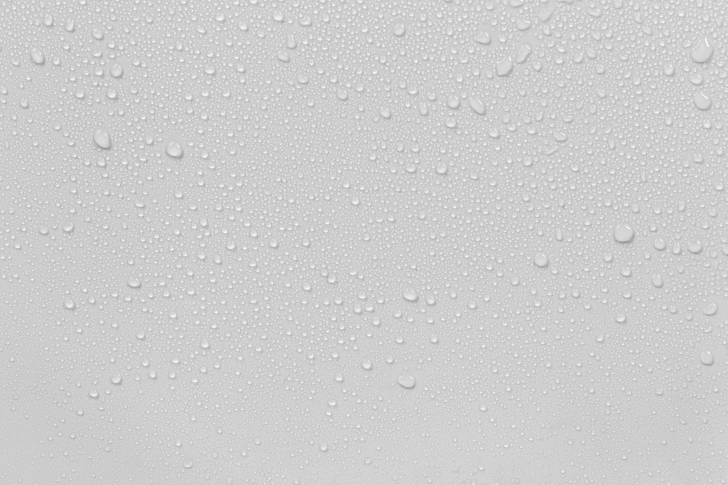 The concept of raindrops falling on a gray background Abstract wet white surface with bubbles on the surface Realistic pure water droplet water drops for creative banner design photo