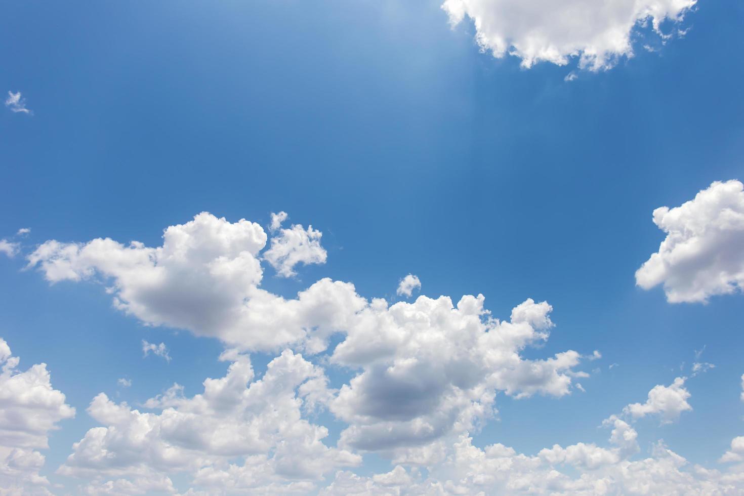 Blue sky background with clouds photo