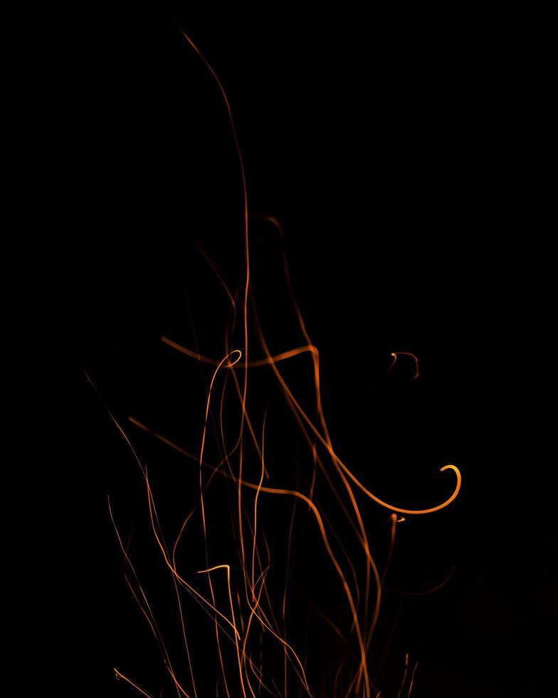fire flames with sparks on a black background photo