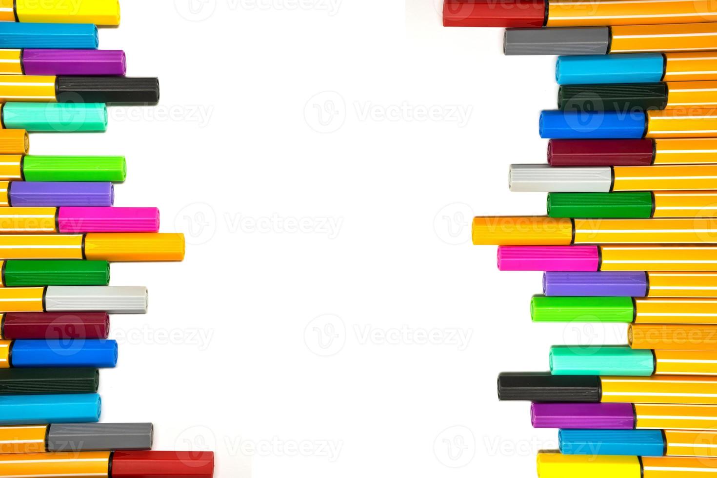 Colorful pens on isolated white background photo