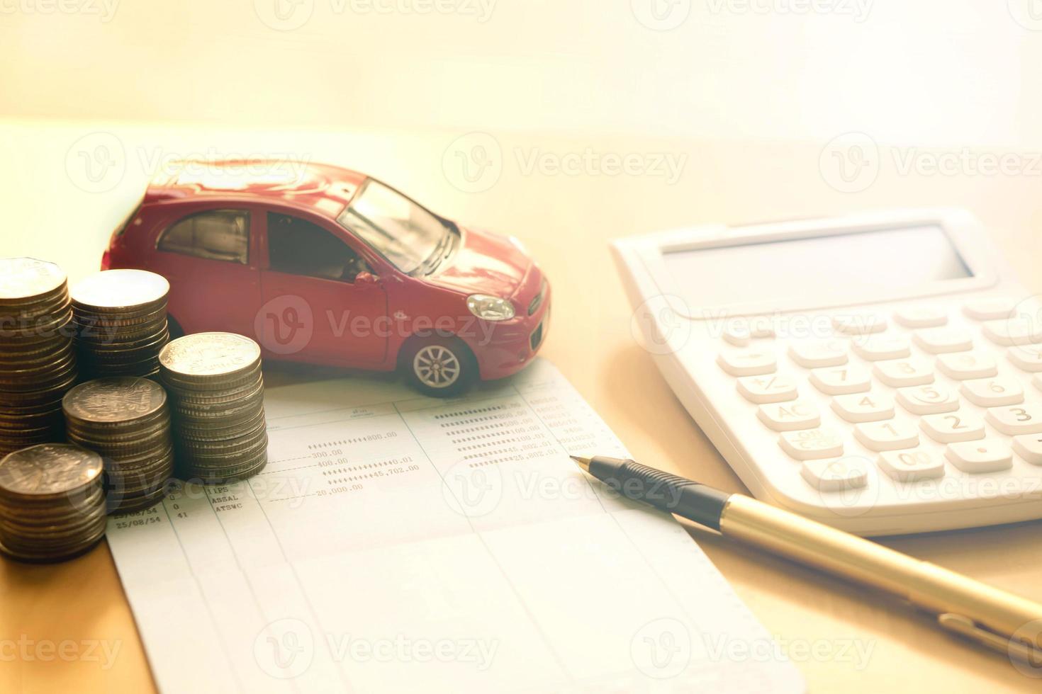 Coins stack in columns, saving book, car. Finance and banking concept. photo