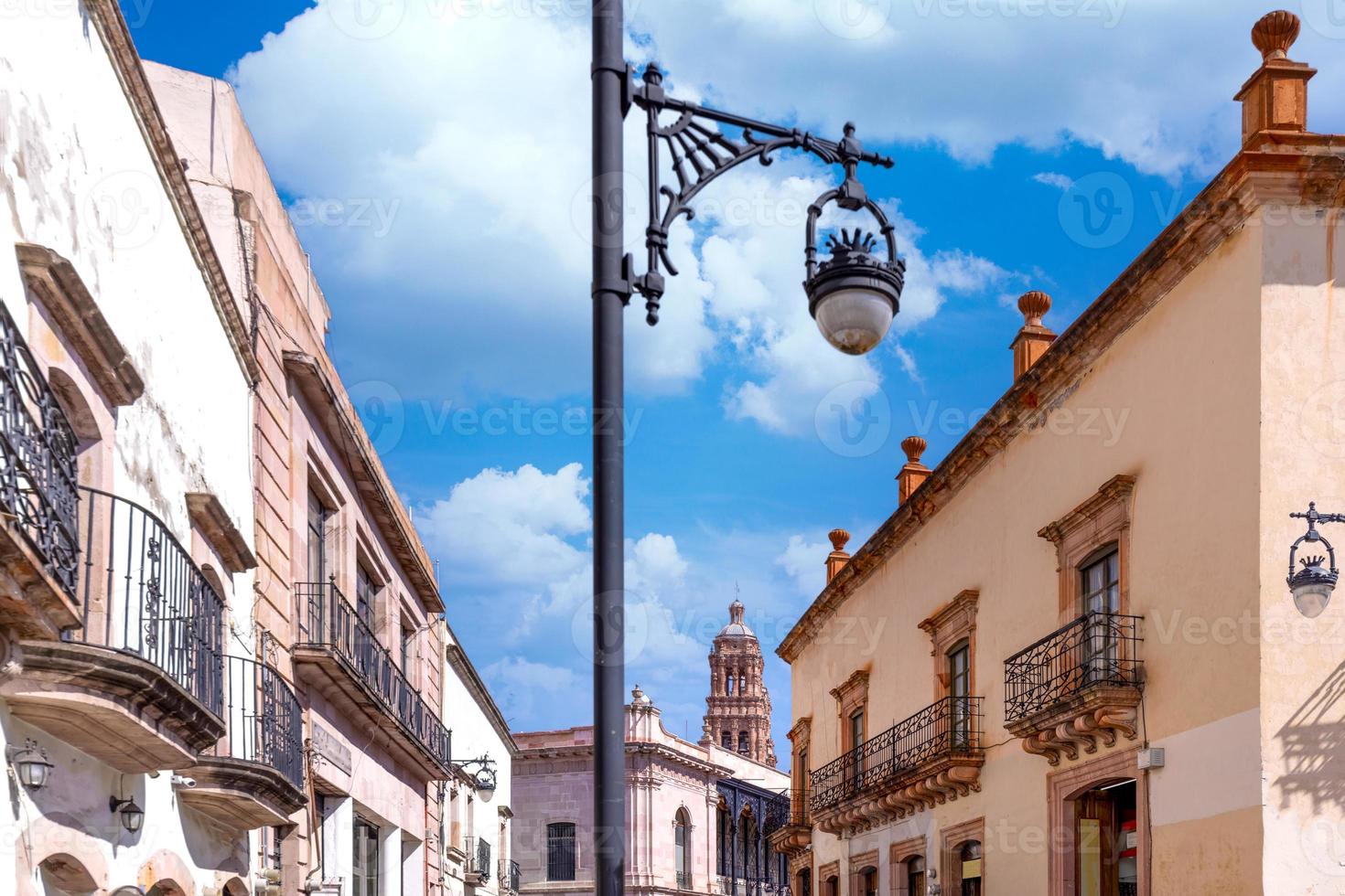 Colorful old city streets in historic city center of Zacatecas near central cathedral. It is a popular local Mexican and international tourism destination photo