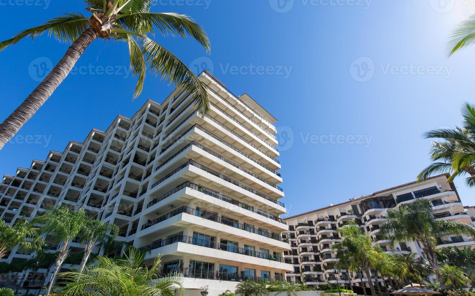 Luxury condominiums and apartments on Playa De Los Muertos beach and pier close to the famous Puerto Vallarta Malecon, the city largest public beach photo