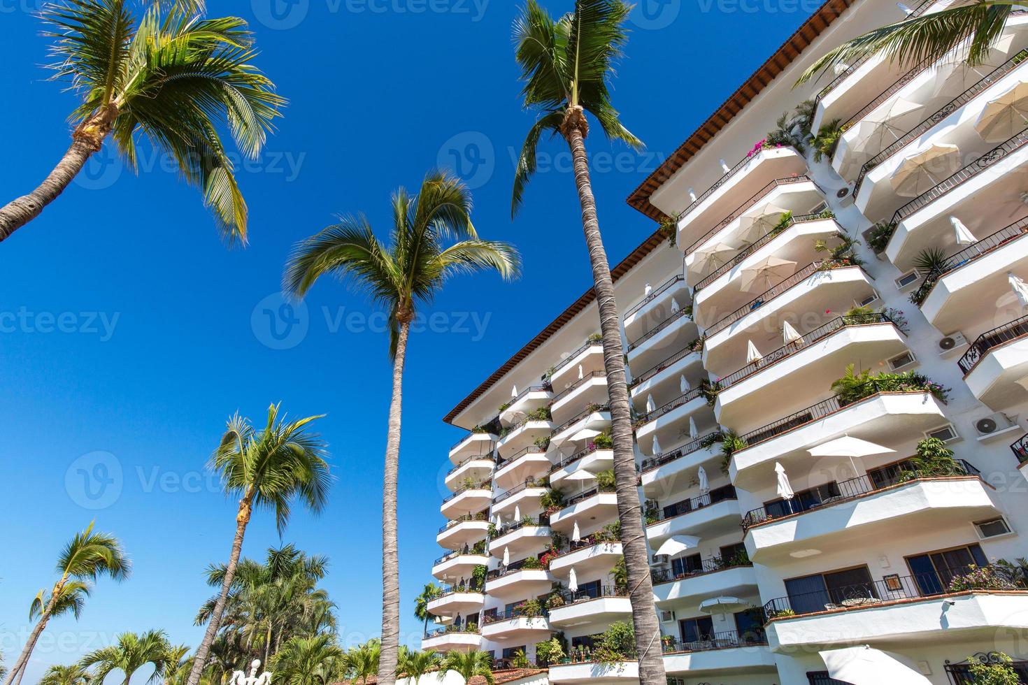 Luxury condominiums and apartments on Playa De Los Muertos beach and pier close to the famous Puerto Vallarta Malecon, the city largest public beach photo