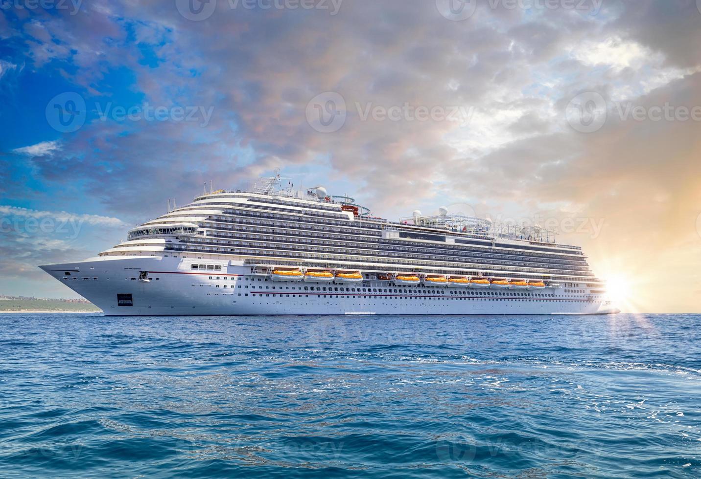 Mexico, Cabo San Lucas, Los Cabos, vacation cruise ship docked close to El Medano beach and scenic landmark tourist destination of Arch of Cabo San Lucas, EL Arco photo