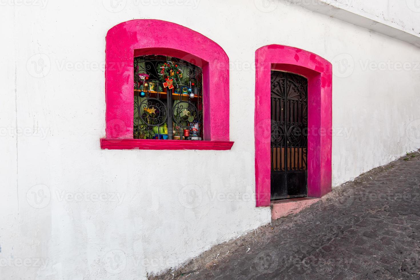 Mexico, Scenic Taxco colonial architecture and cobblestone narrow streets in historic city center near Santa Prisca church photo
