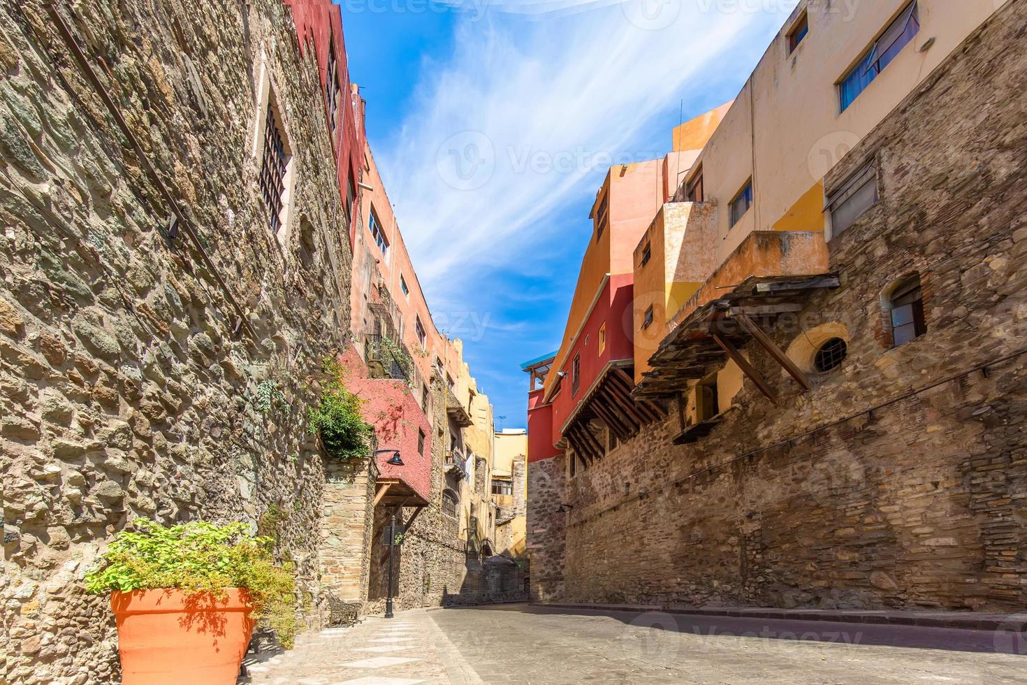 Scenic cobbled streets and traditional colorful colonial  architecture in Guanajuato historic city center photo