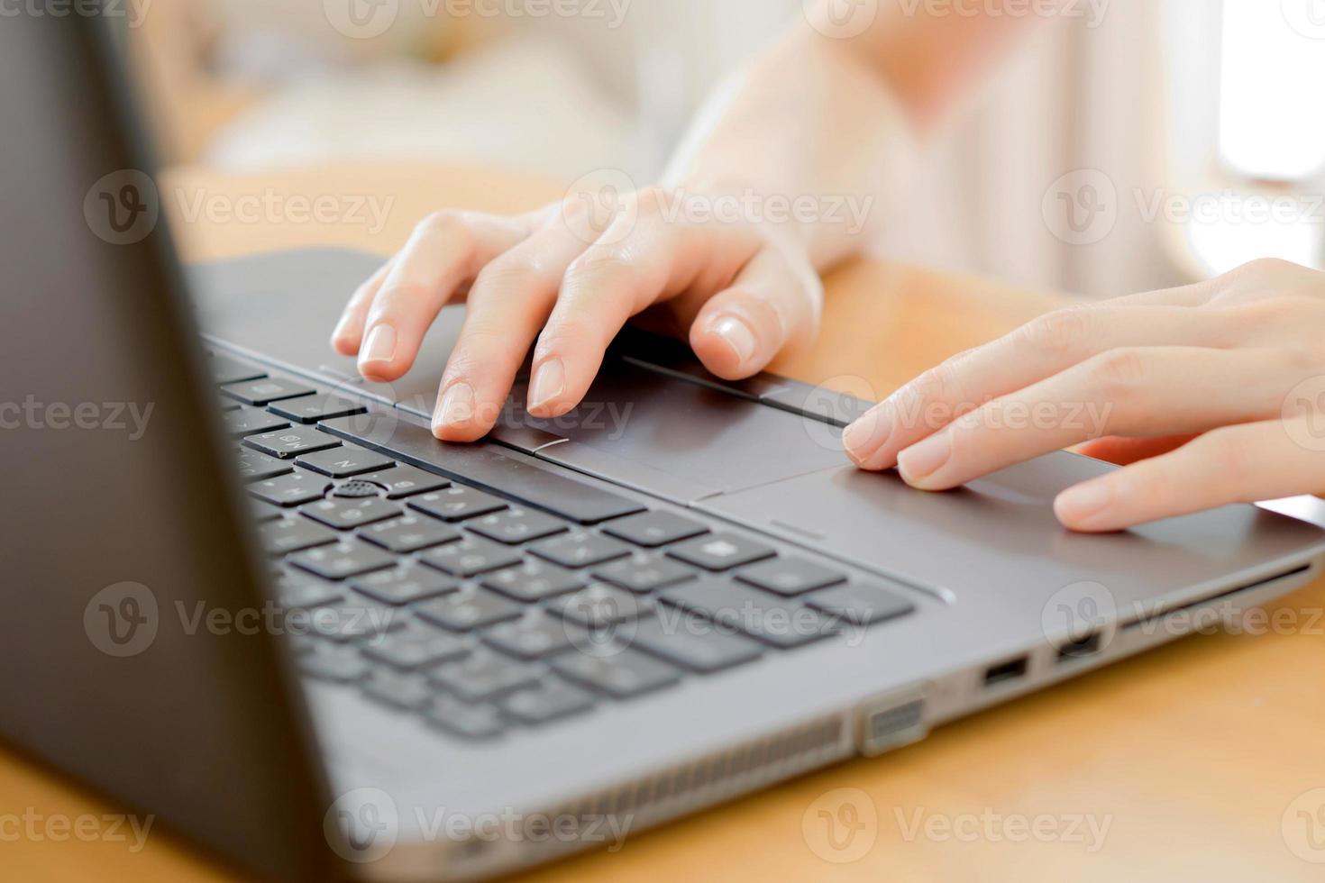 programmer's hand typing with laptop. focus on his finger photo