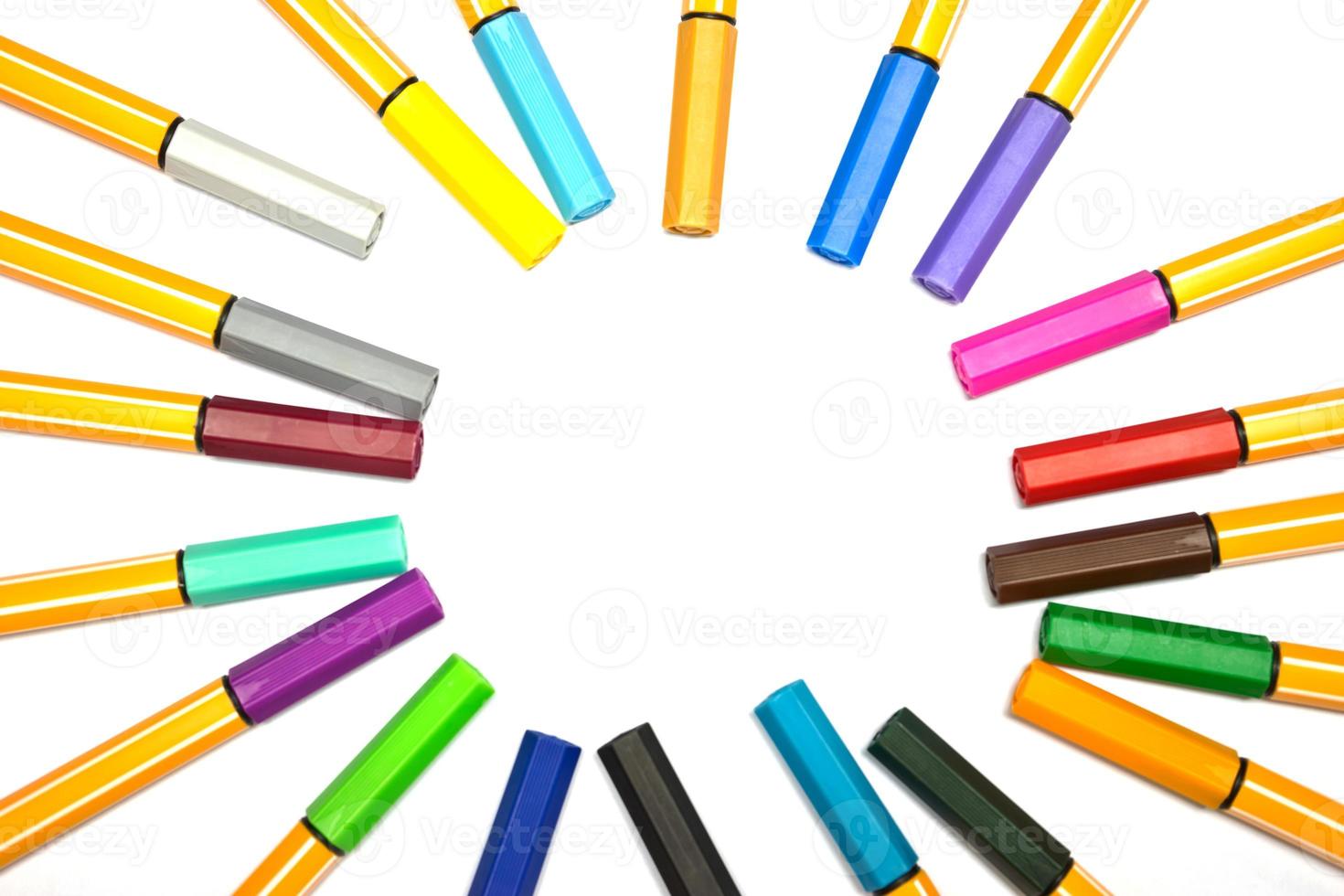 Colorful pens on isolated white background photo