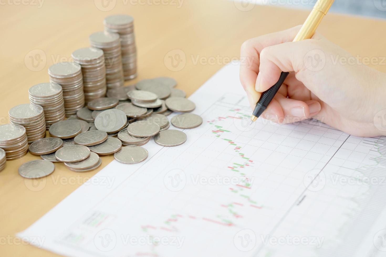 Summary report and financial analyzing concept, Pen and coins photo