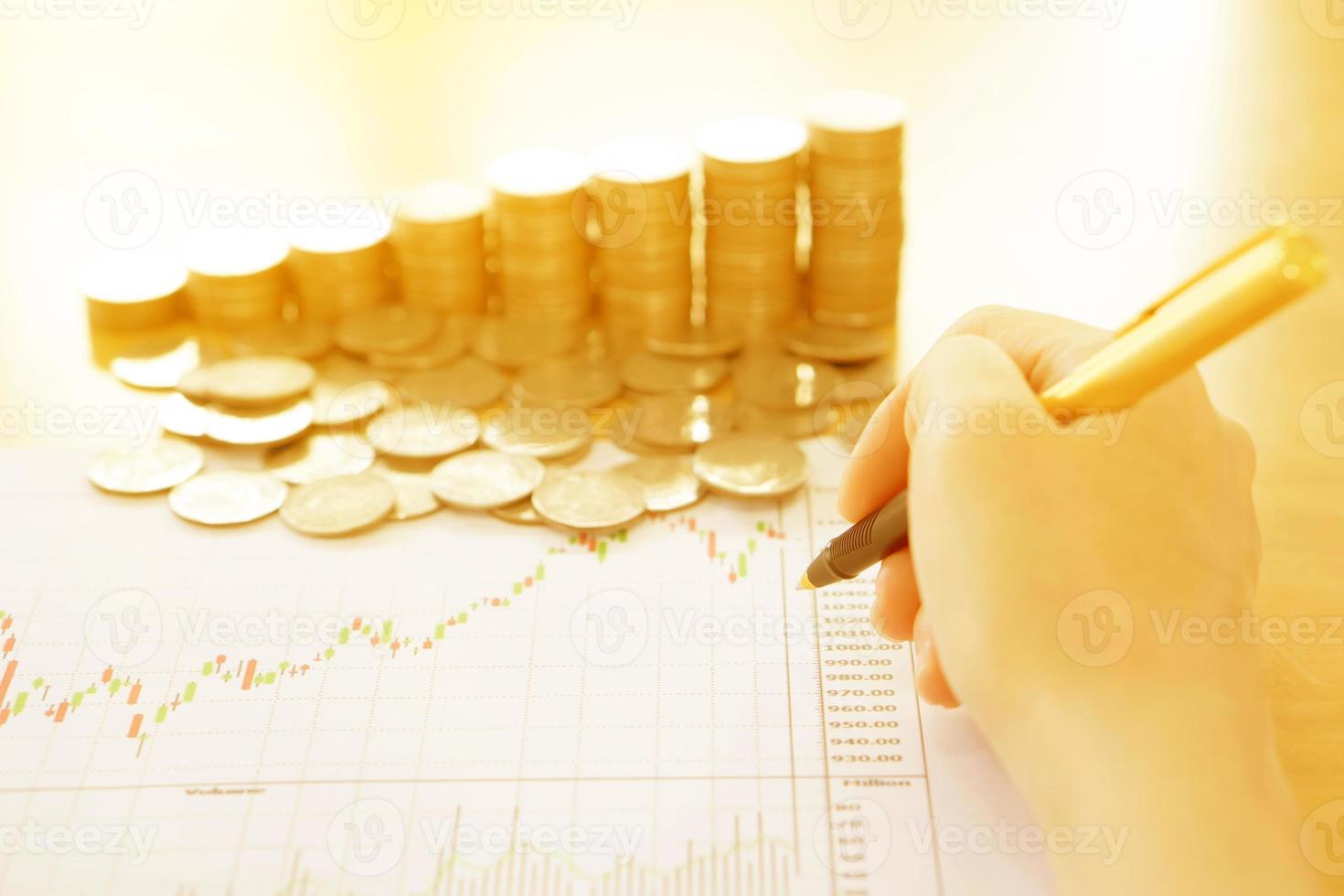 Summary report and financial analyzing concept, Pen and coins photo