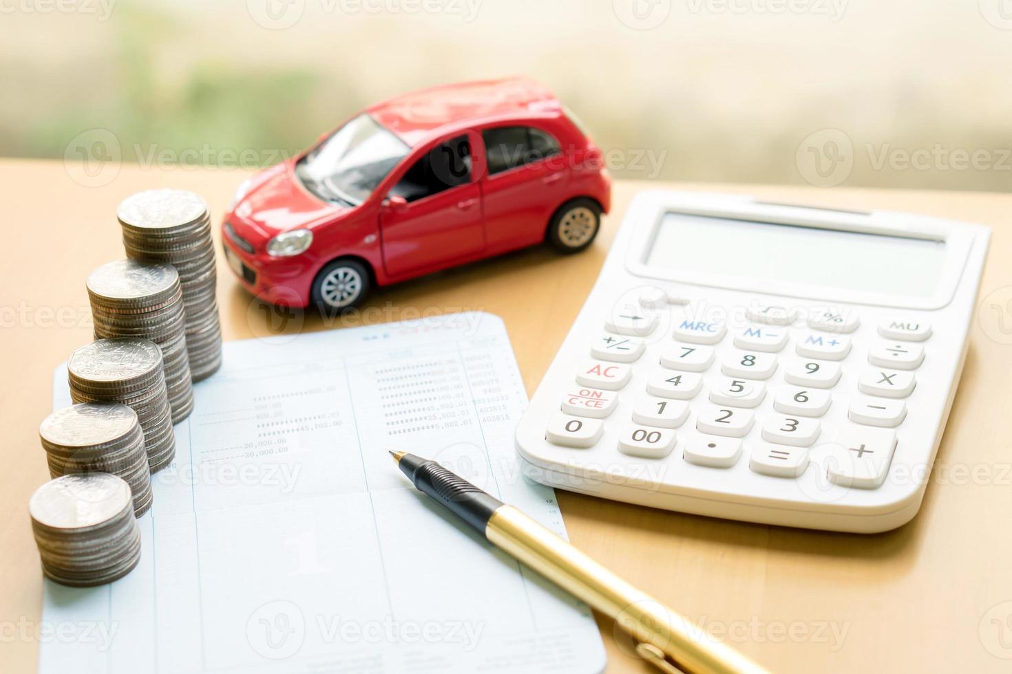 Coins stack in columns on saving book and car on finance concept photo