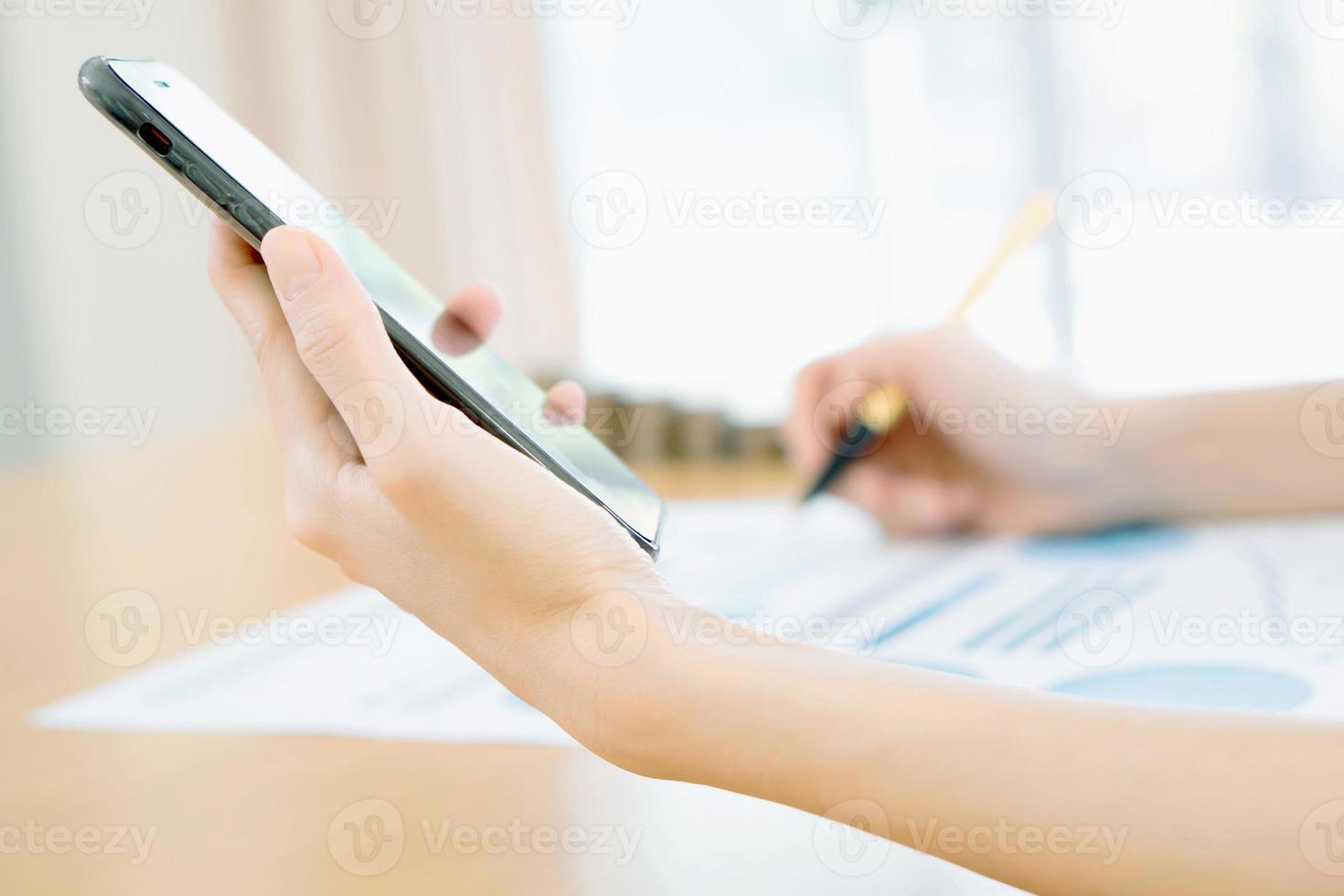 Women using her Smartphone photo