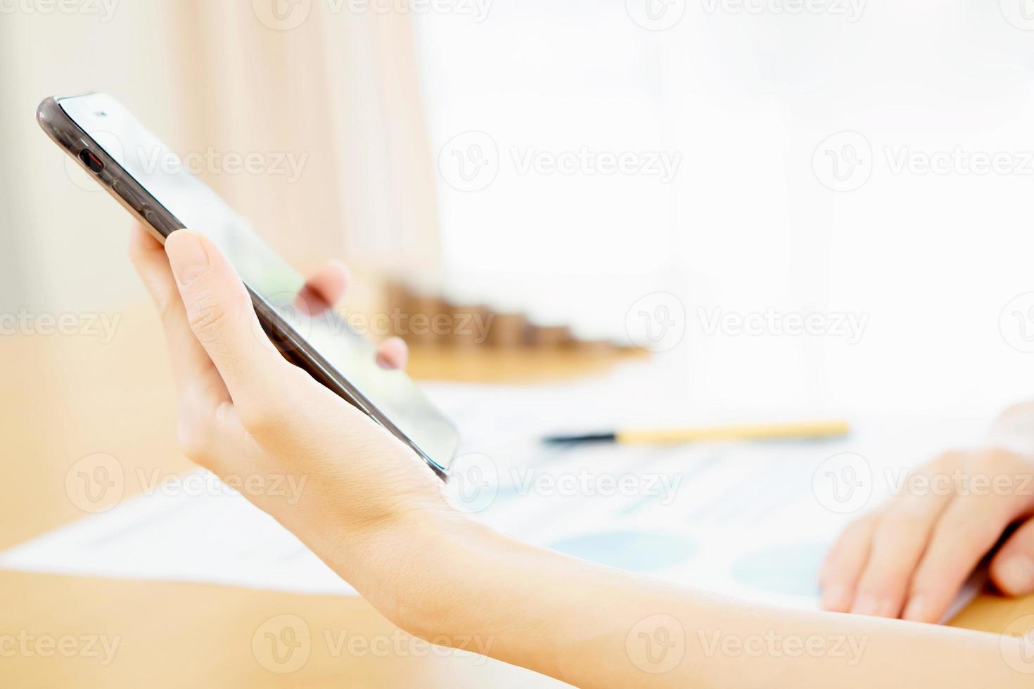 Women using her Smartphone photo