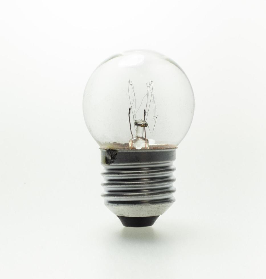 The old light bulb on the white background photo