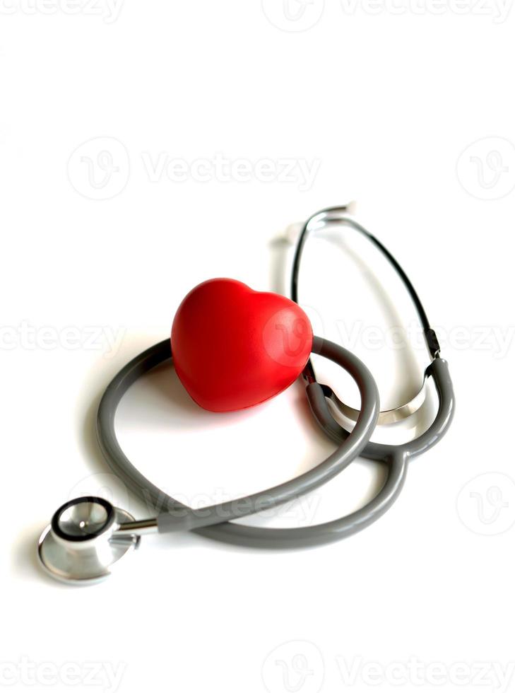 A heart with a stethoscope, isolated on white background photo