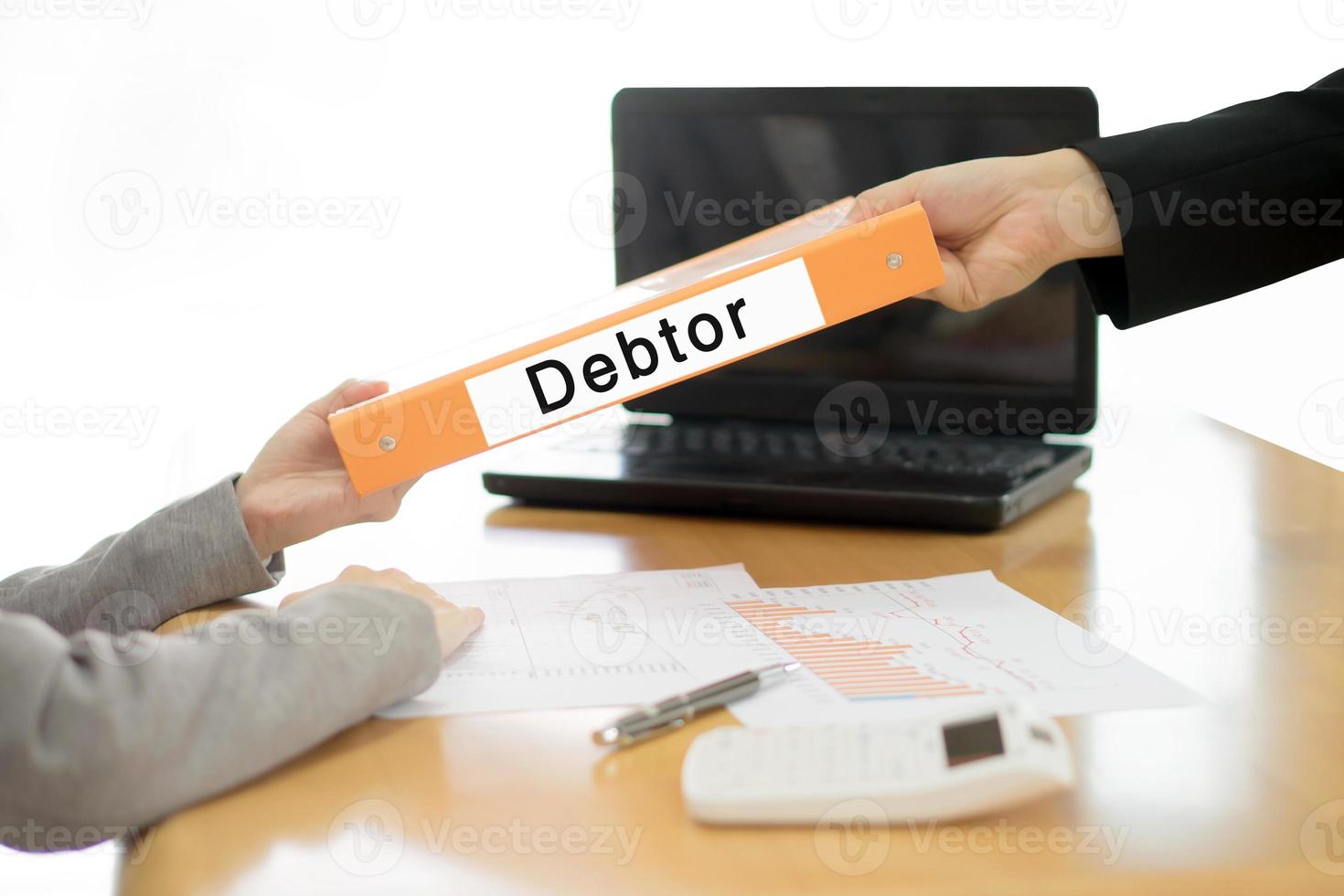 Businesswoman sends the debtor document to the businessman. selective focus. photo