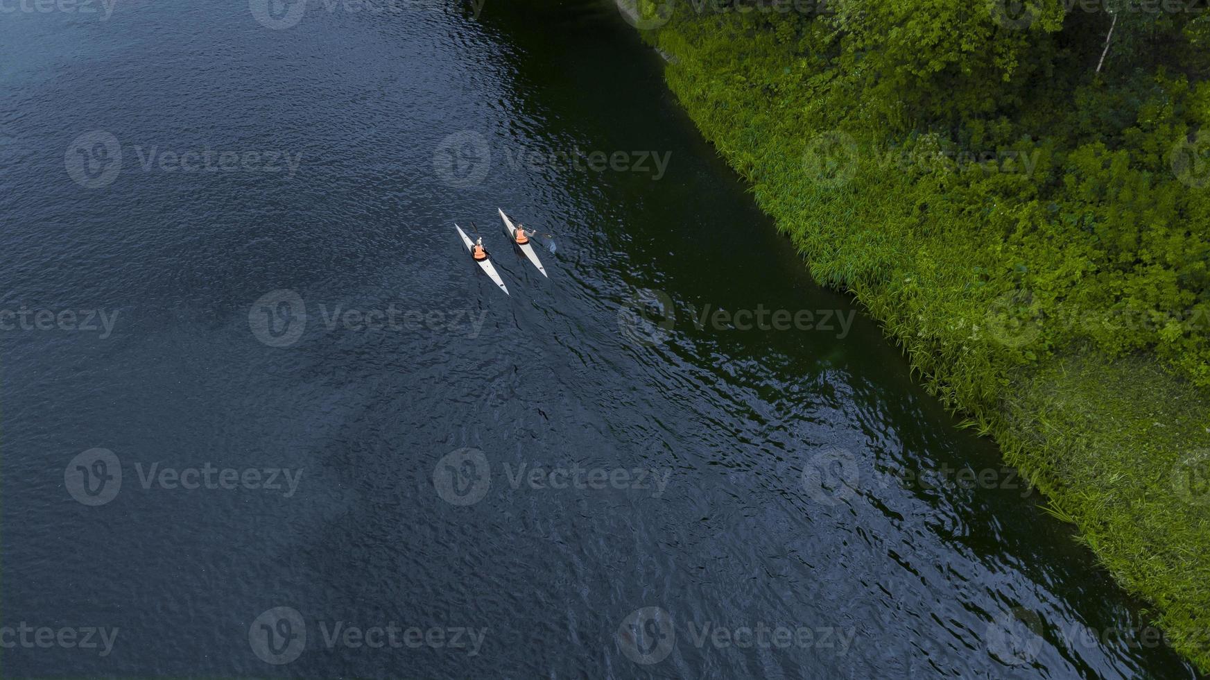 two swimmers floating down the river the view from the drone photo
