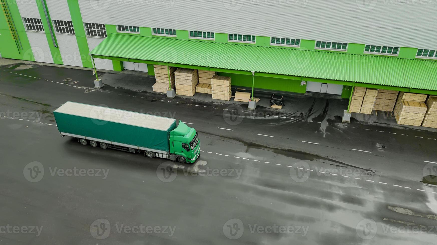 trucks are waiting to be loaded in the logistics center top view aerial photography from a drone photo