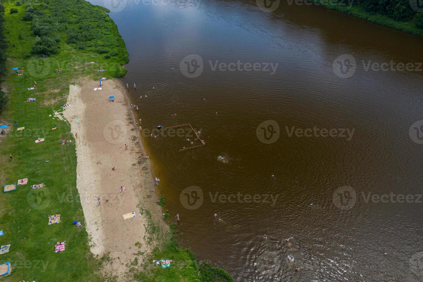 beach on the river Bank with people swimming view from above photo