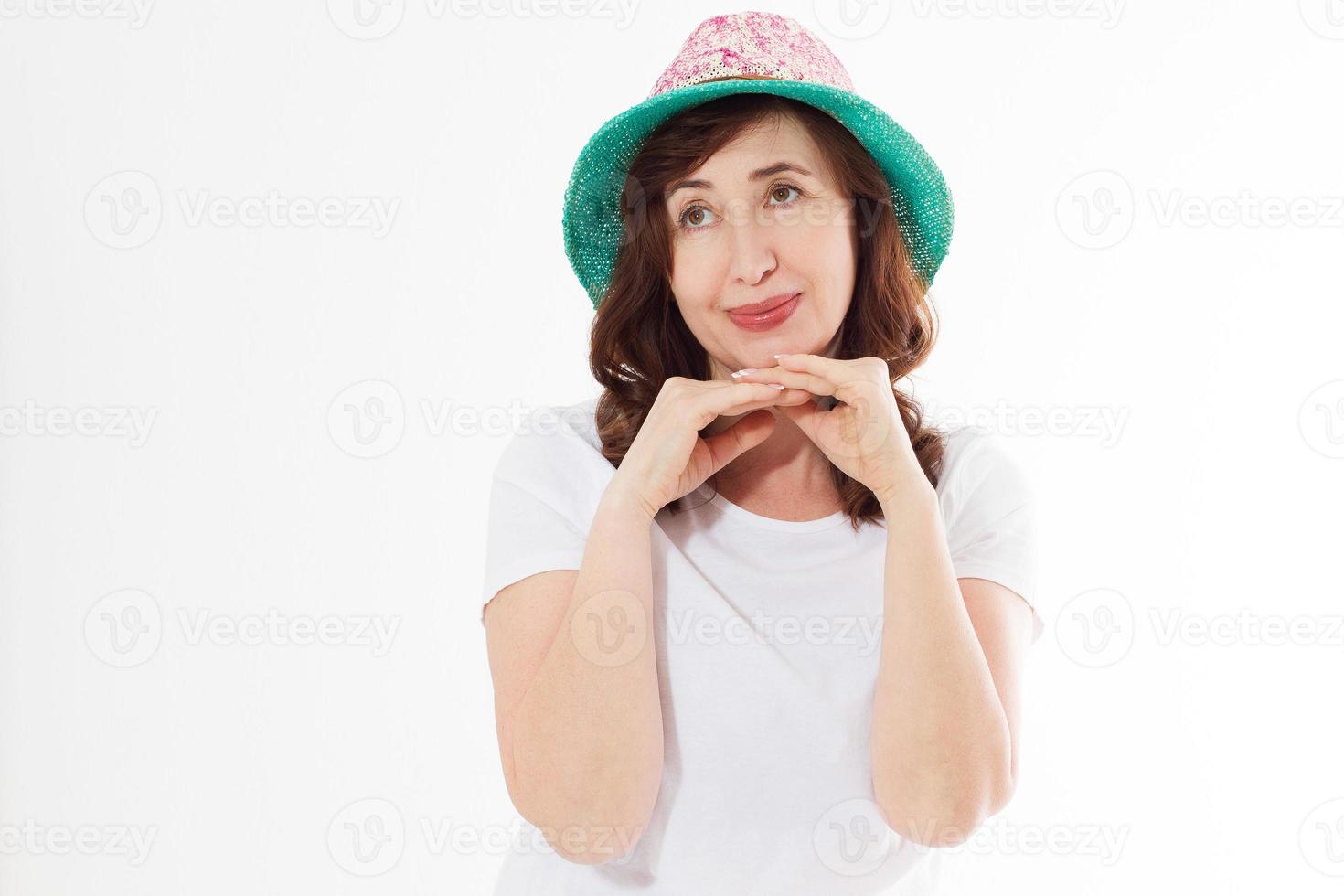 Happy woman in summer hat isolated on white background. Sun protection skin care and vacation holidays concept. Middle age female with white healthy teeth and menopause. Travel vacation. Copy space photo