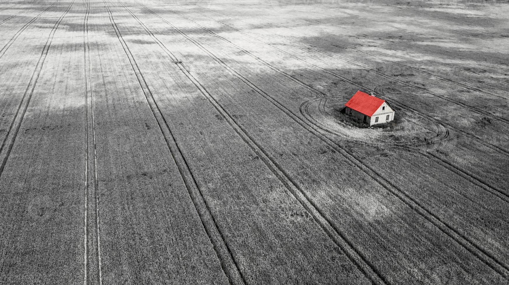 lonely house in the middle of the field aerial photo