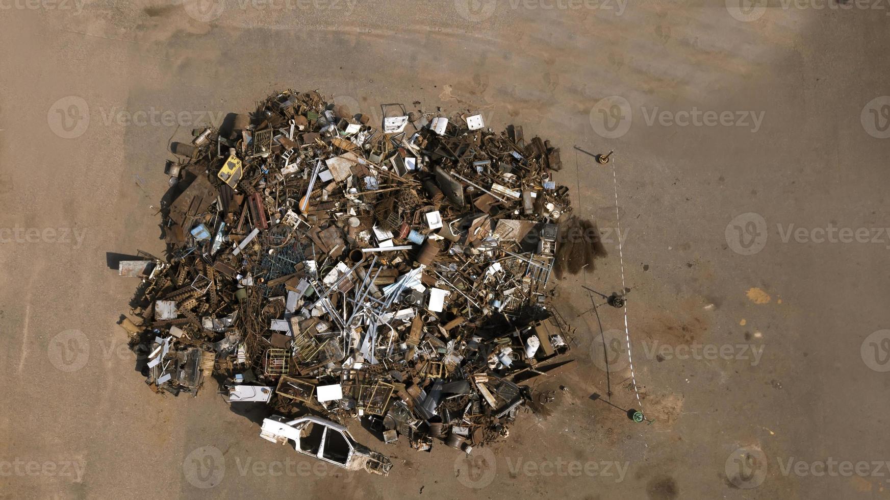 a pile of garbage from scrap metal top view aerial photography from a drone photo