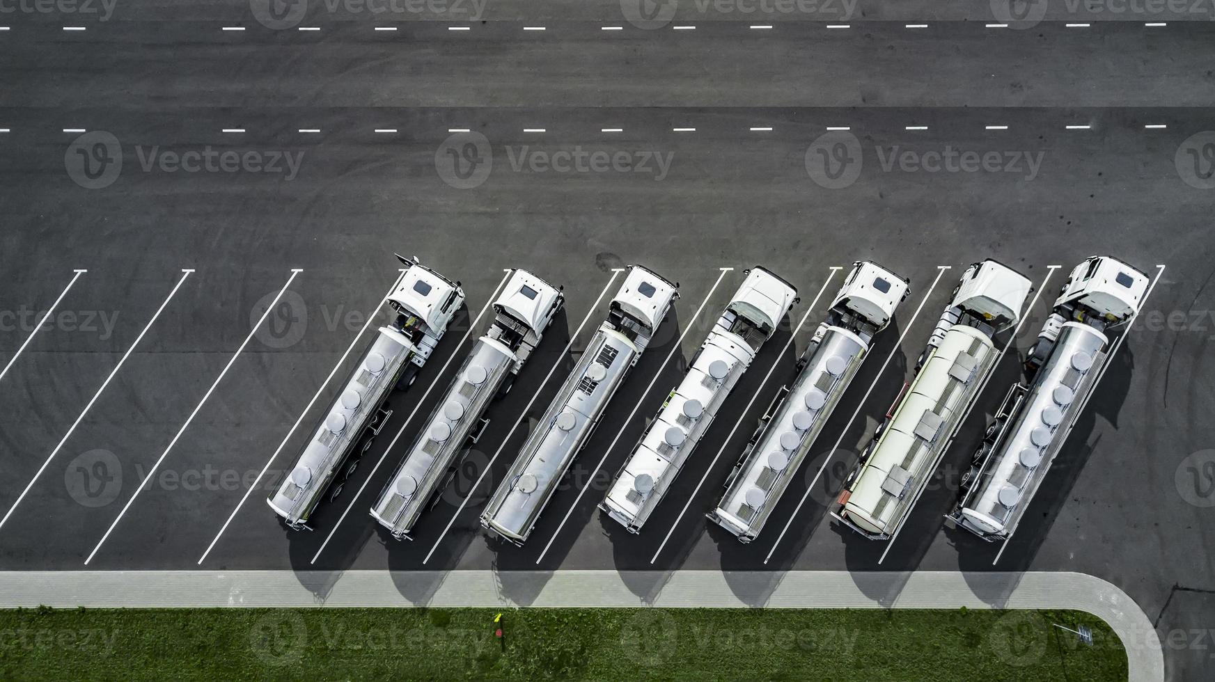 trucks stand in a row in the Parking lot top view. logistics centre. photo