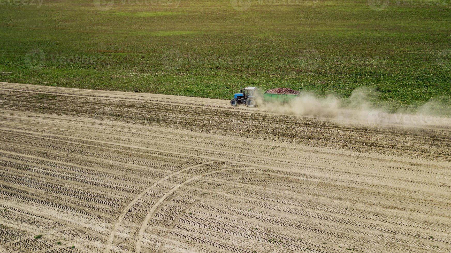 Tractor in a farmer field top view photo