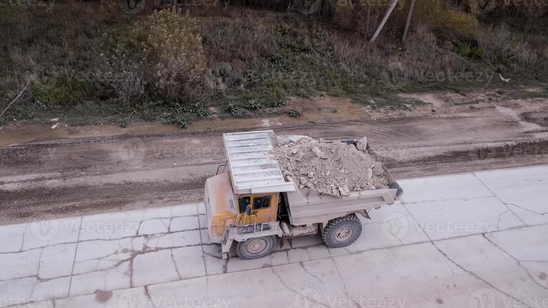 the truck transports the minerals from the top view from the drone photo