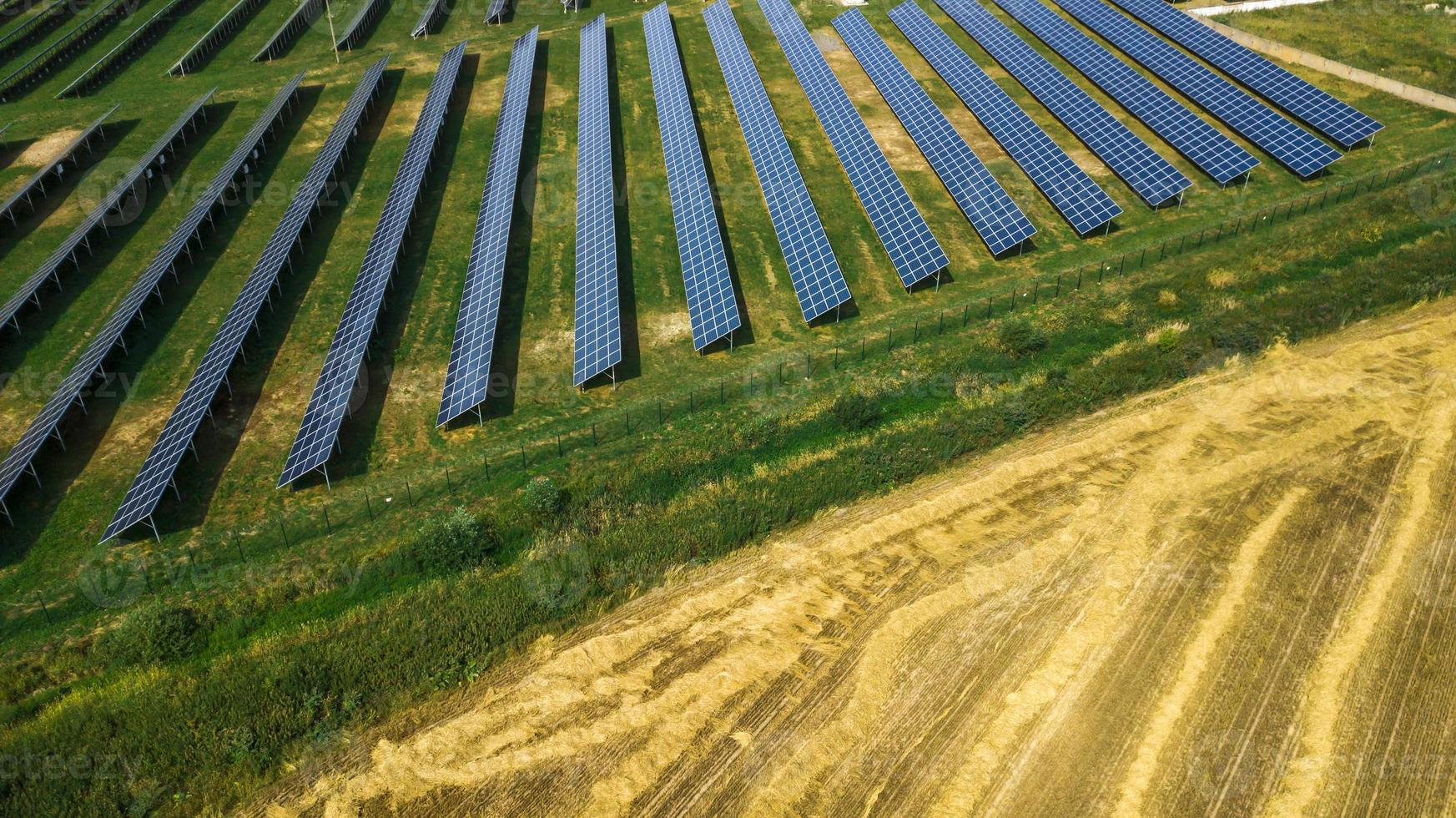 Aerial shot top view of solar panel photovoltaic farm photo