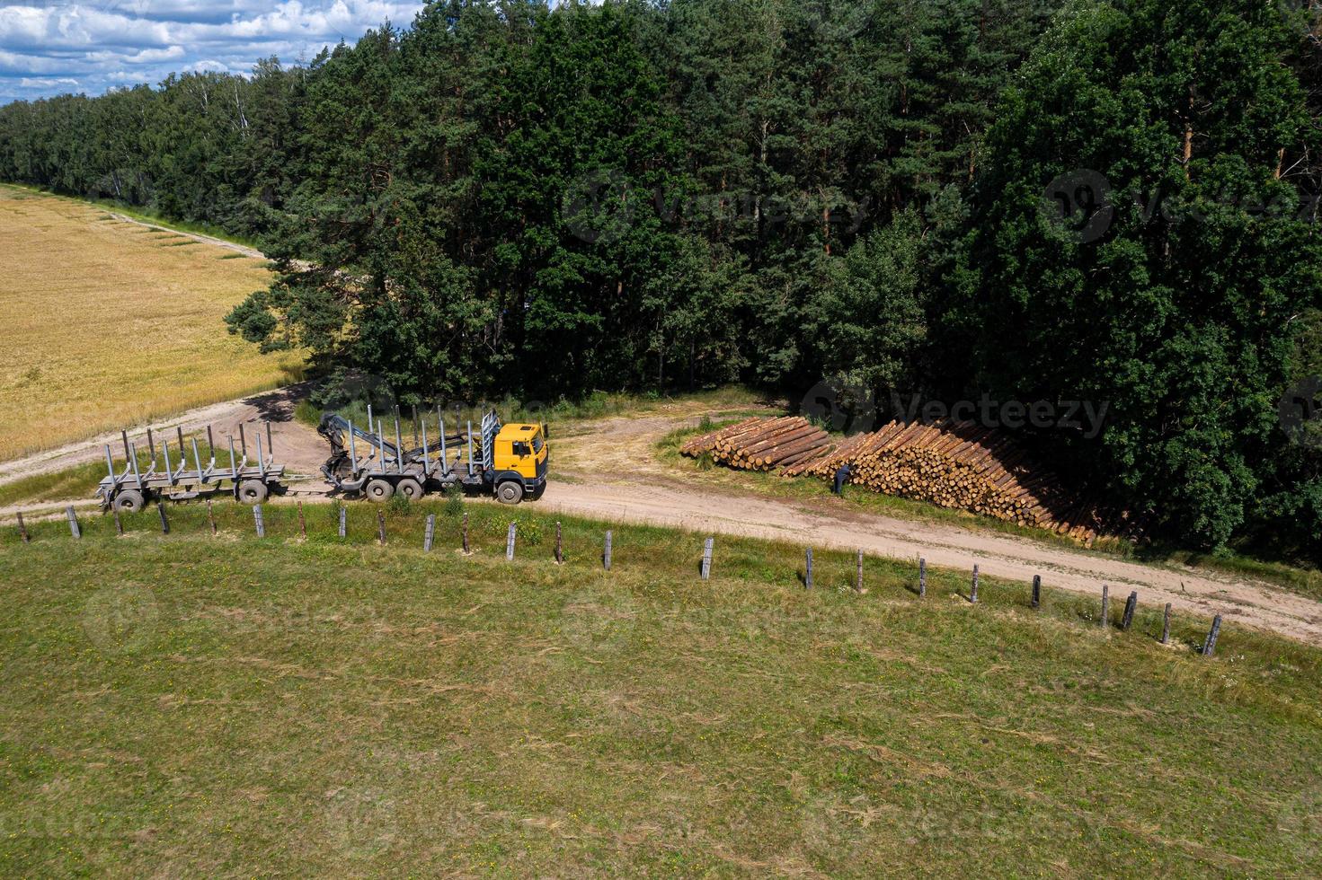 The logging truck is preparing for loading. Logging the view from the top. photo