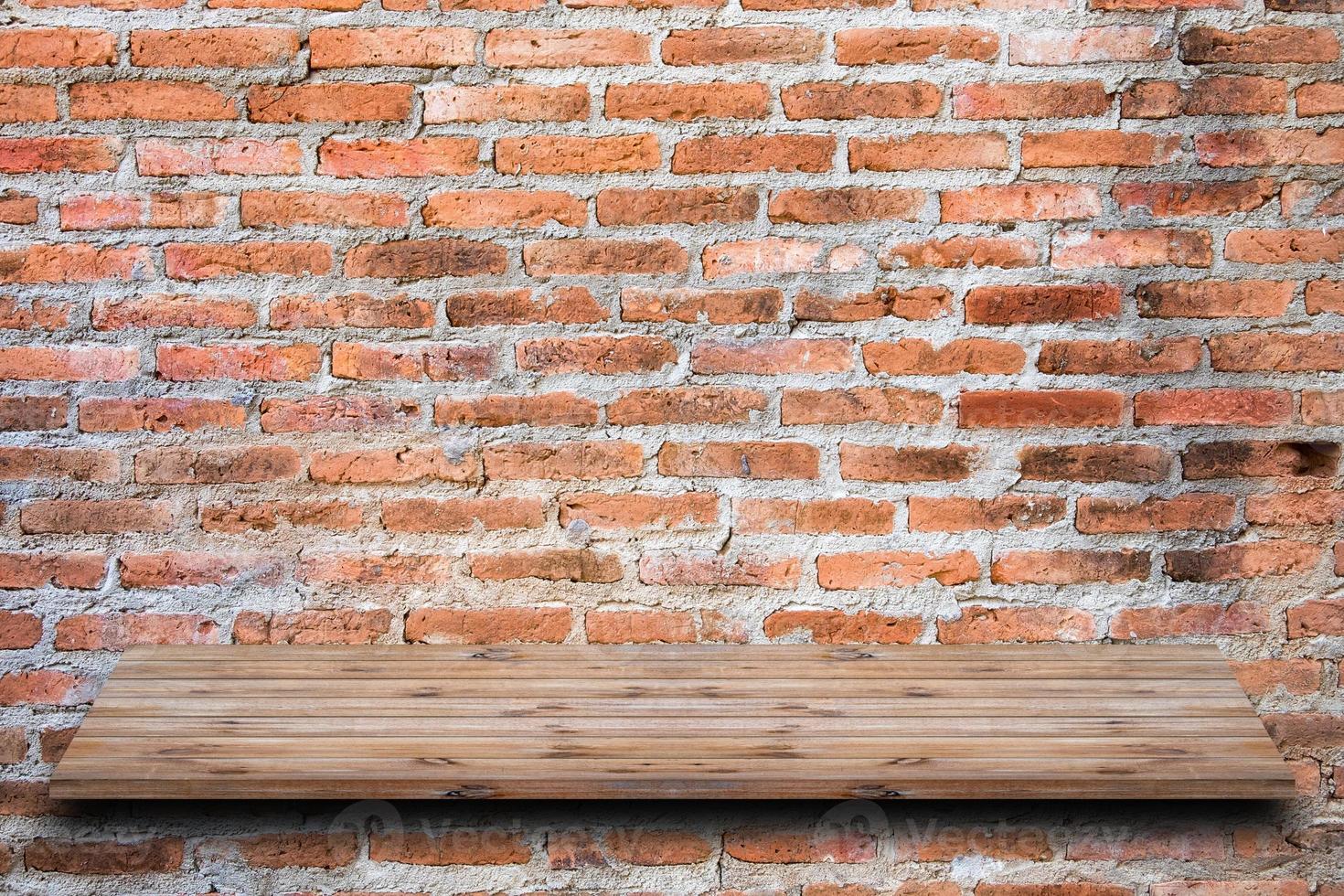 Brown brick wall stacked with shelf wooden photo