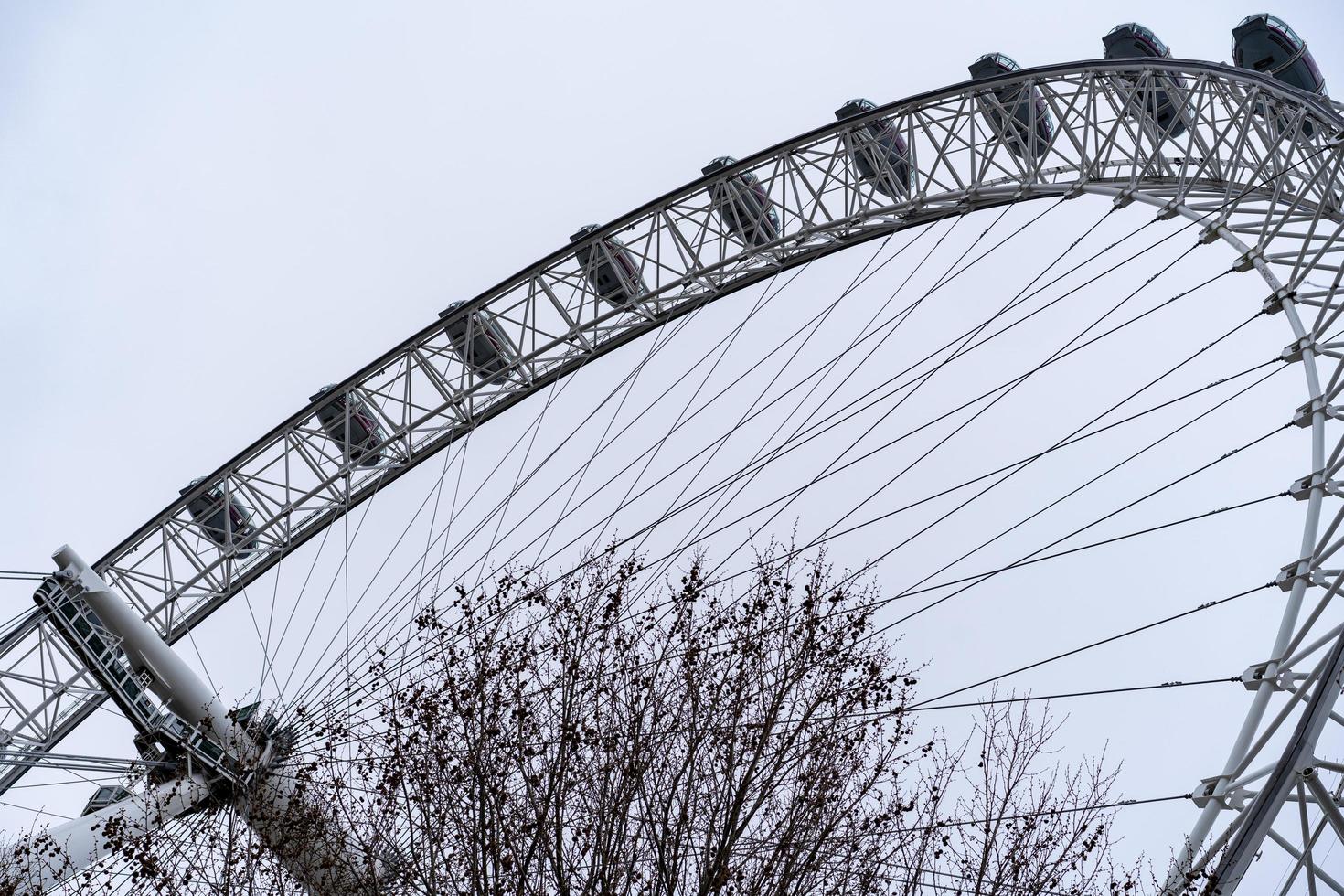 London eye from ground level with machinery photo