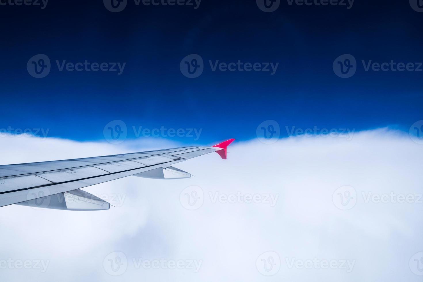 View airplane cloudy in sky photo