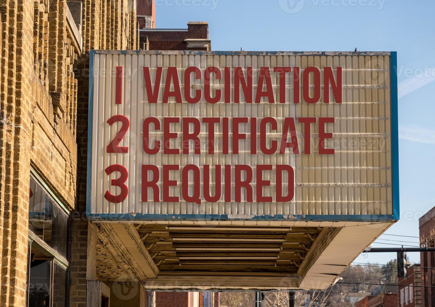 Concept of vaccination mandate for entry into public areas on cinema board photo