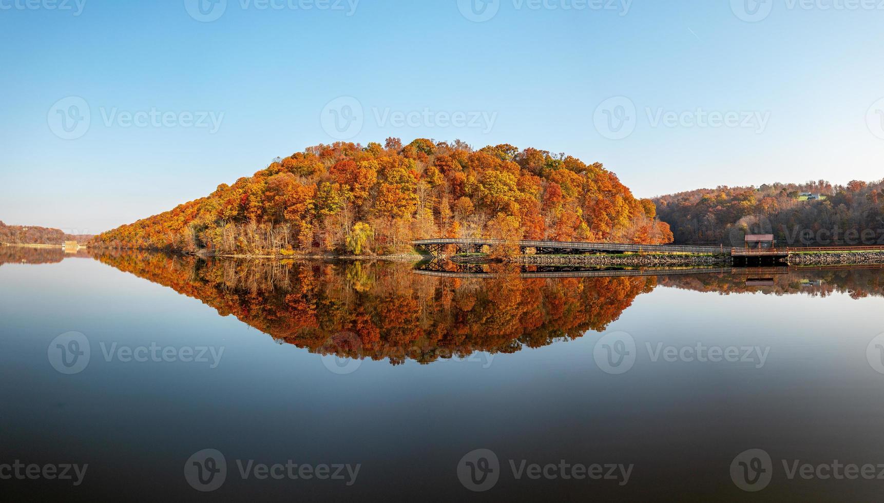 Perfect reflection of autumn leaves in Cheat Lake photo