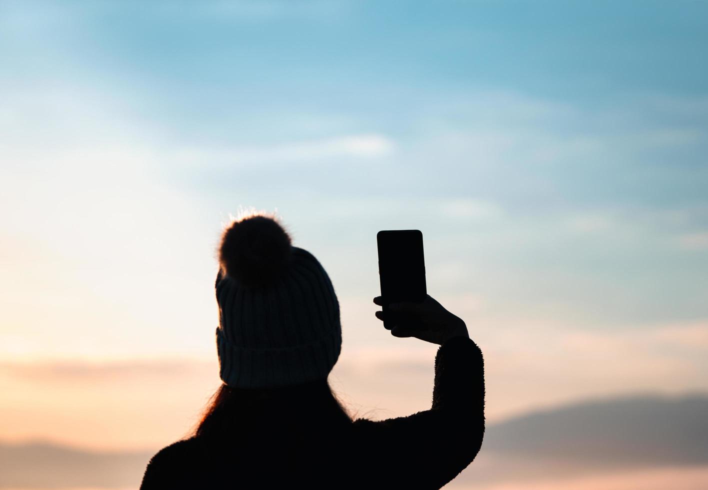 Silhouette adult woman solo traveller. photo