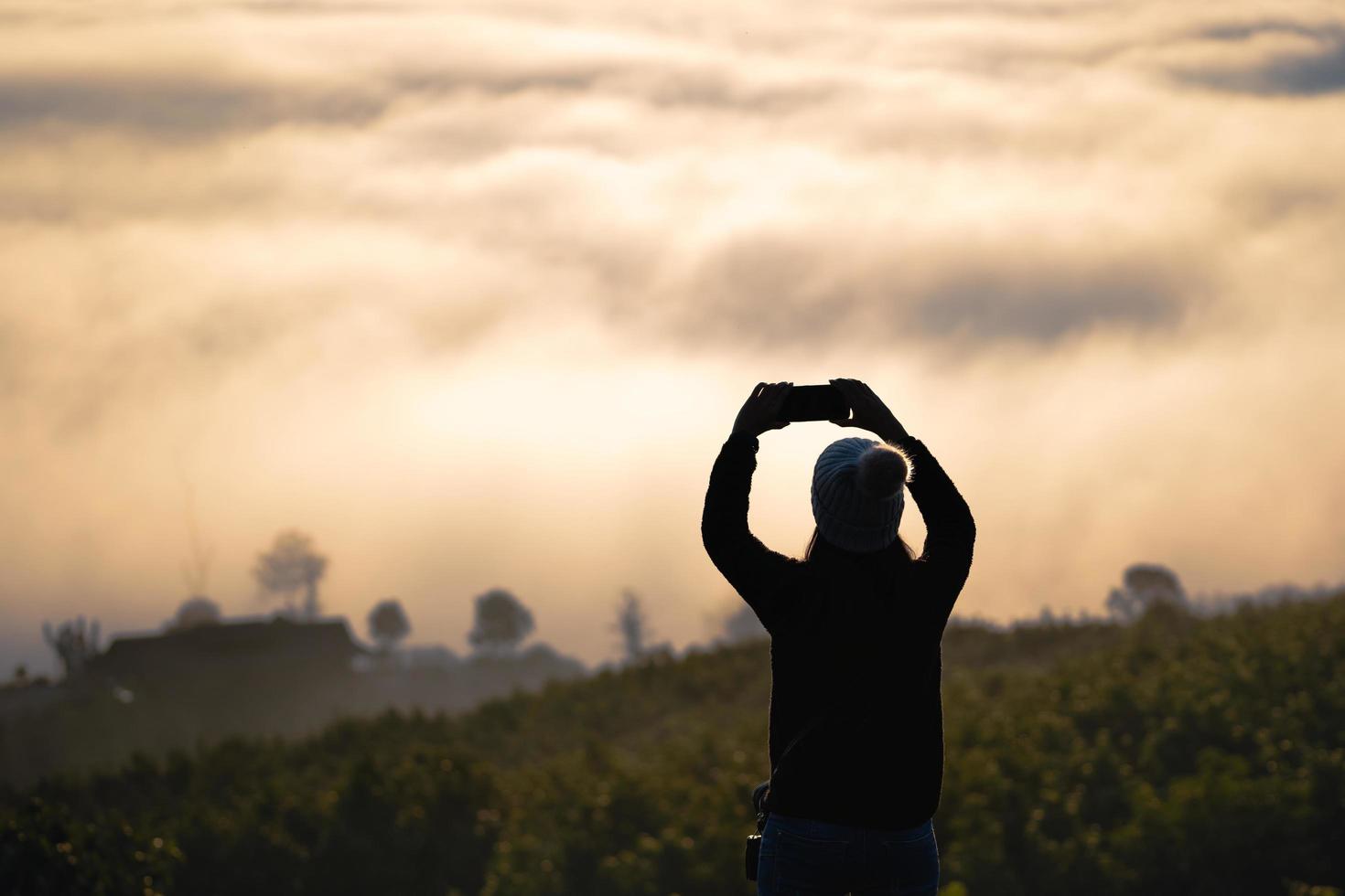 Silhouette adult woman solo traveller. photo