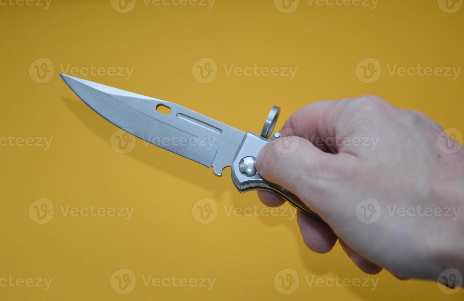 Knife as a cold piercing and cutting weapon for self-defense photo