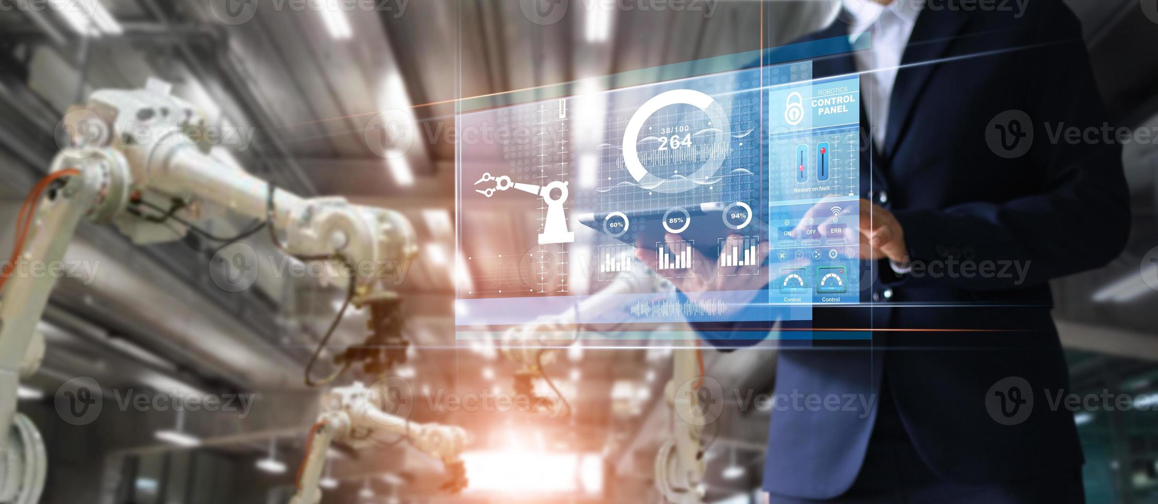 Manager industrial Engineer using tablet check and control automation robot arms machine in intelligent factory industrial over system on virtual interface screen, Industry 4.0 concept photo