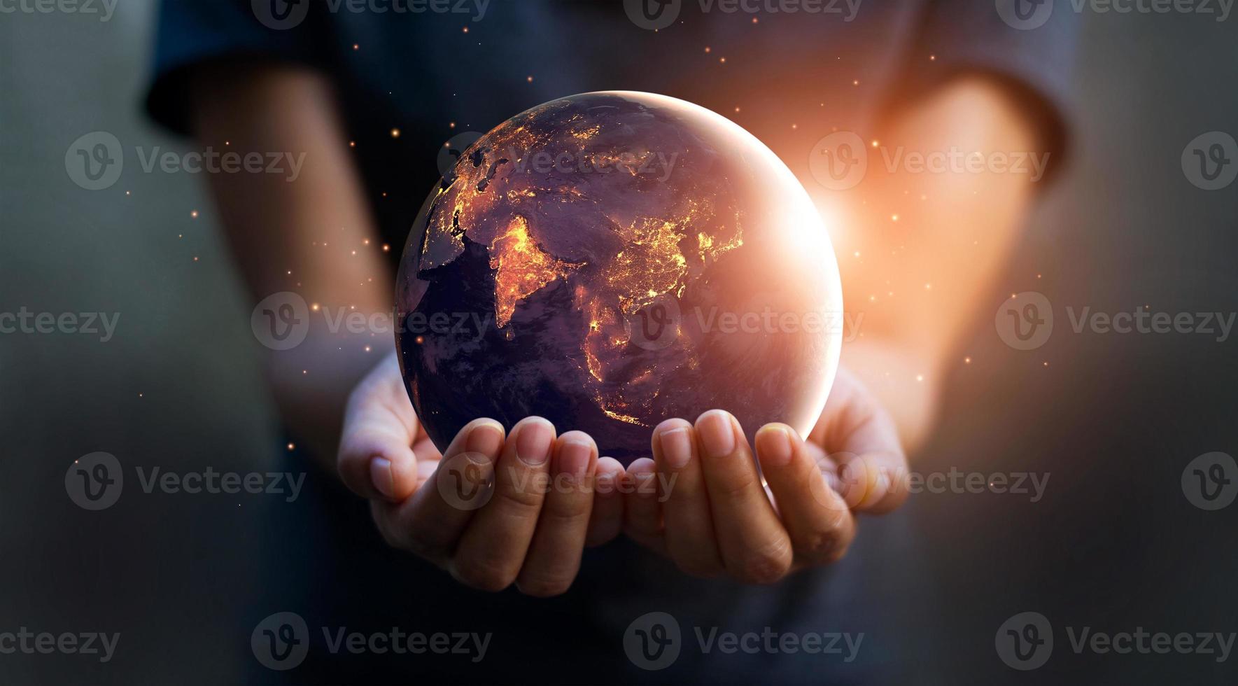 Earth at night was holding in human hands. Earth day. Energy saving concept, Elements of this image furnished by NASA photo