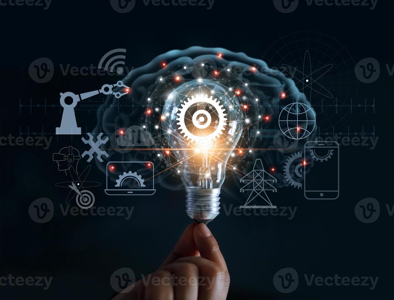 Hand holding light bulb and cog inside and innovation icon network connection on brain background, innovative technology in science and industrial concept photo