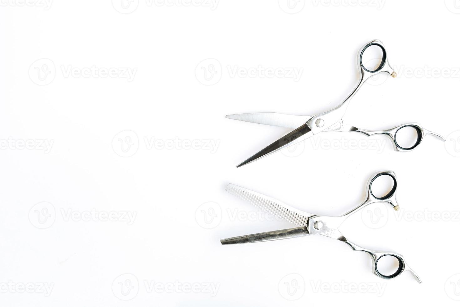 Professional barber's hair cutting tools set on white background. photo