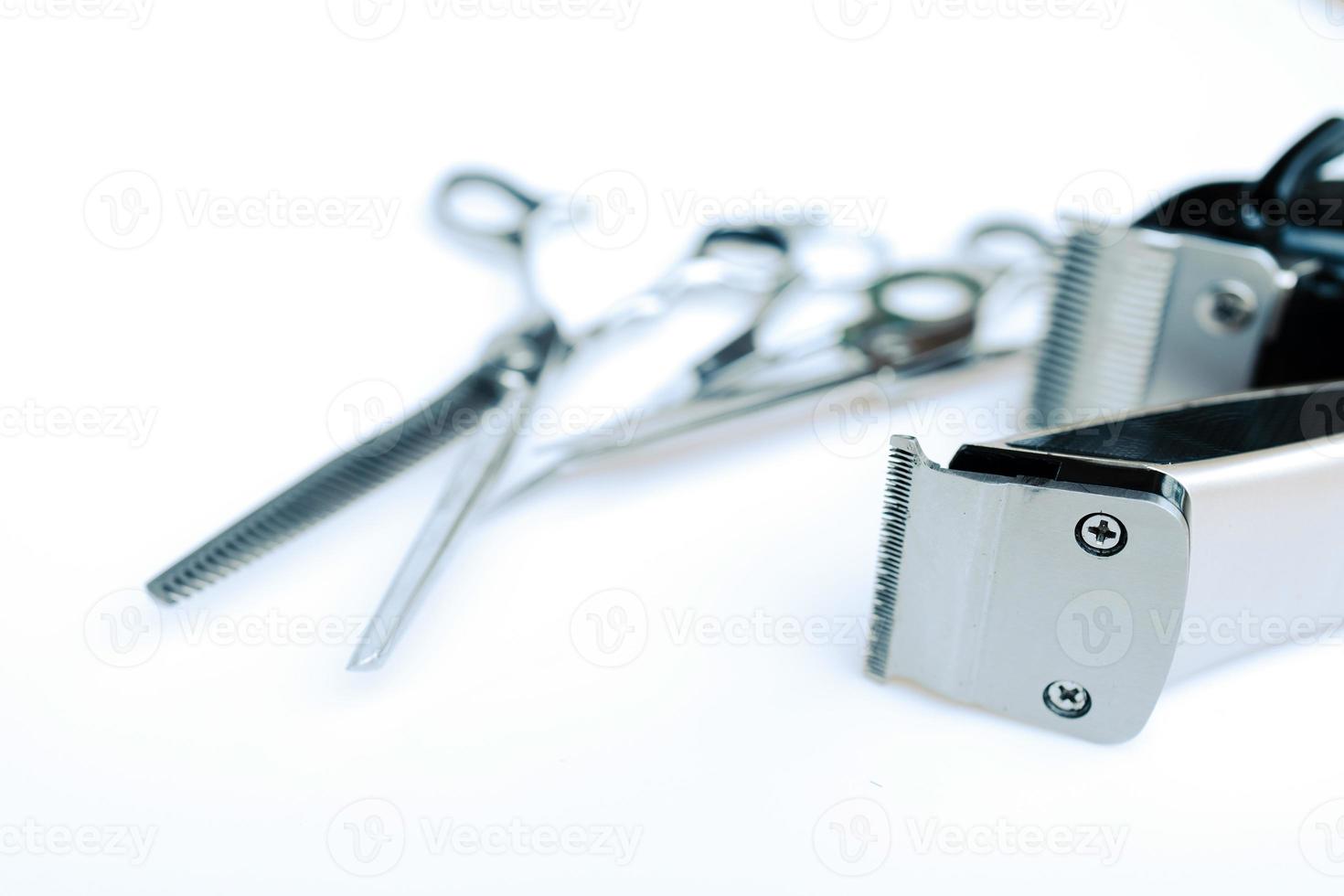 Professional barber's hair cutting tools set on white background. photo