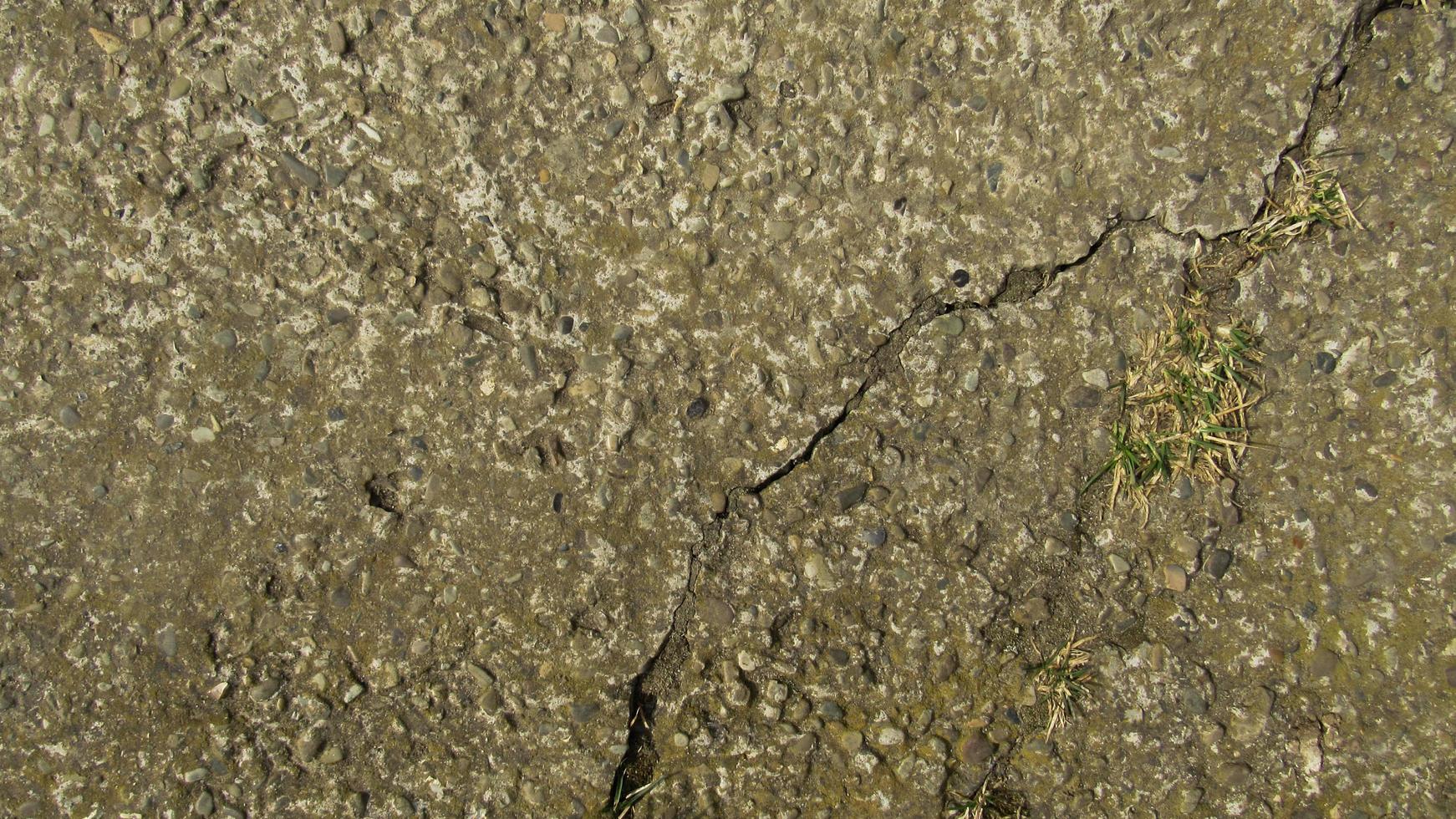 old cracked concrete. Grunge concrete cement wall with crack, for your design and background texture. stone walkway. concrete texture photo