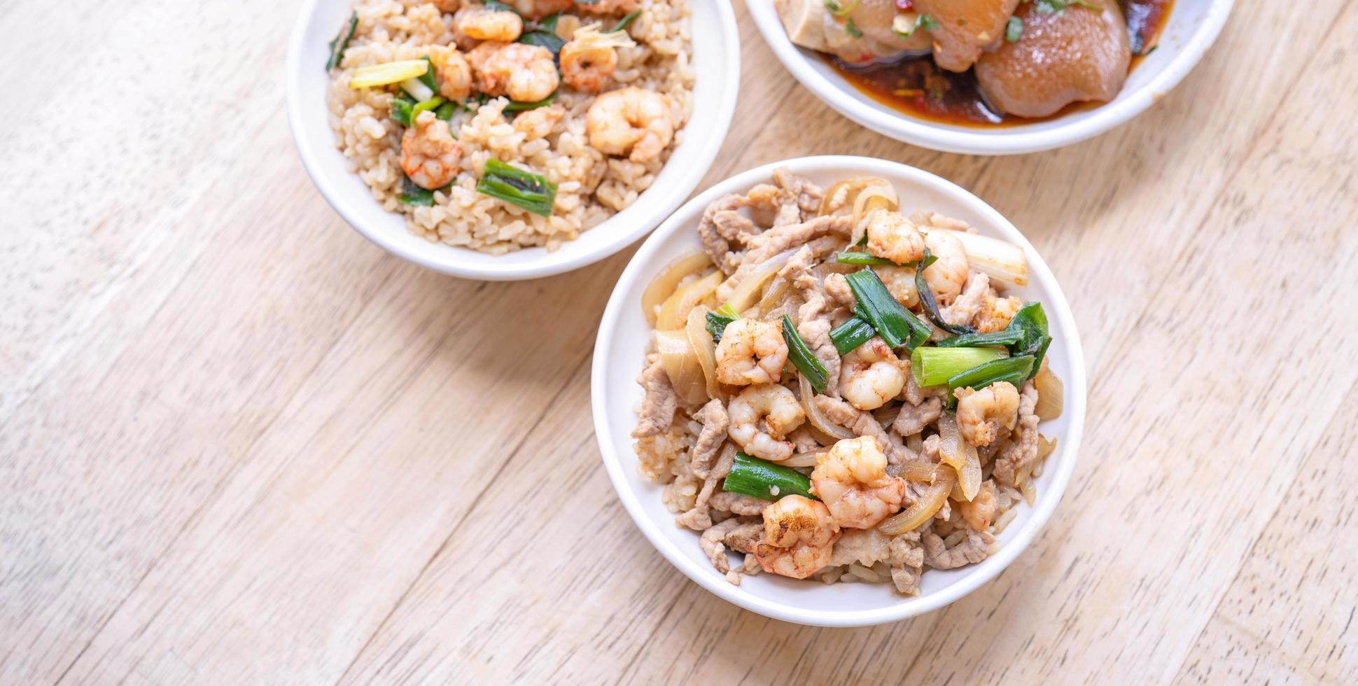 Braised shrimp over rice - Taiwan famous traditional street food. Soy-stewed prawn on cooked rice. Travel concept, top view, copy space, close up photo