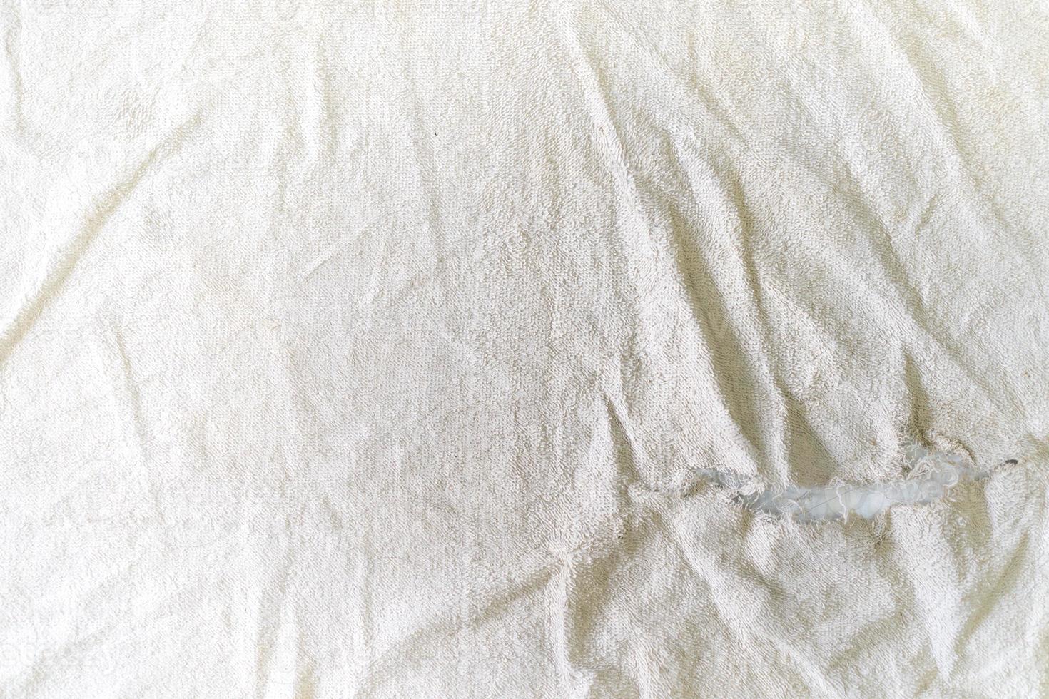 teared rag spread out to flat on the floor, can use like a background or any texture. photo