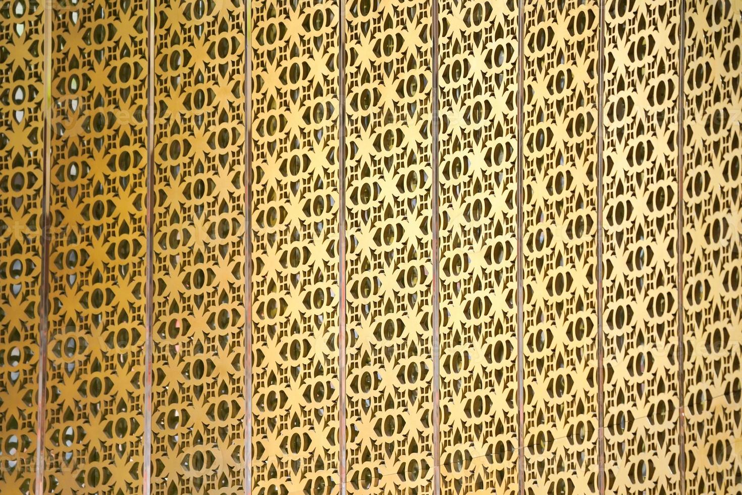 the Golden craft Thai pattern popup on the wall backdrop in some place at Thailand. photo