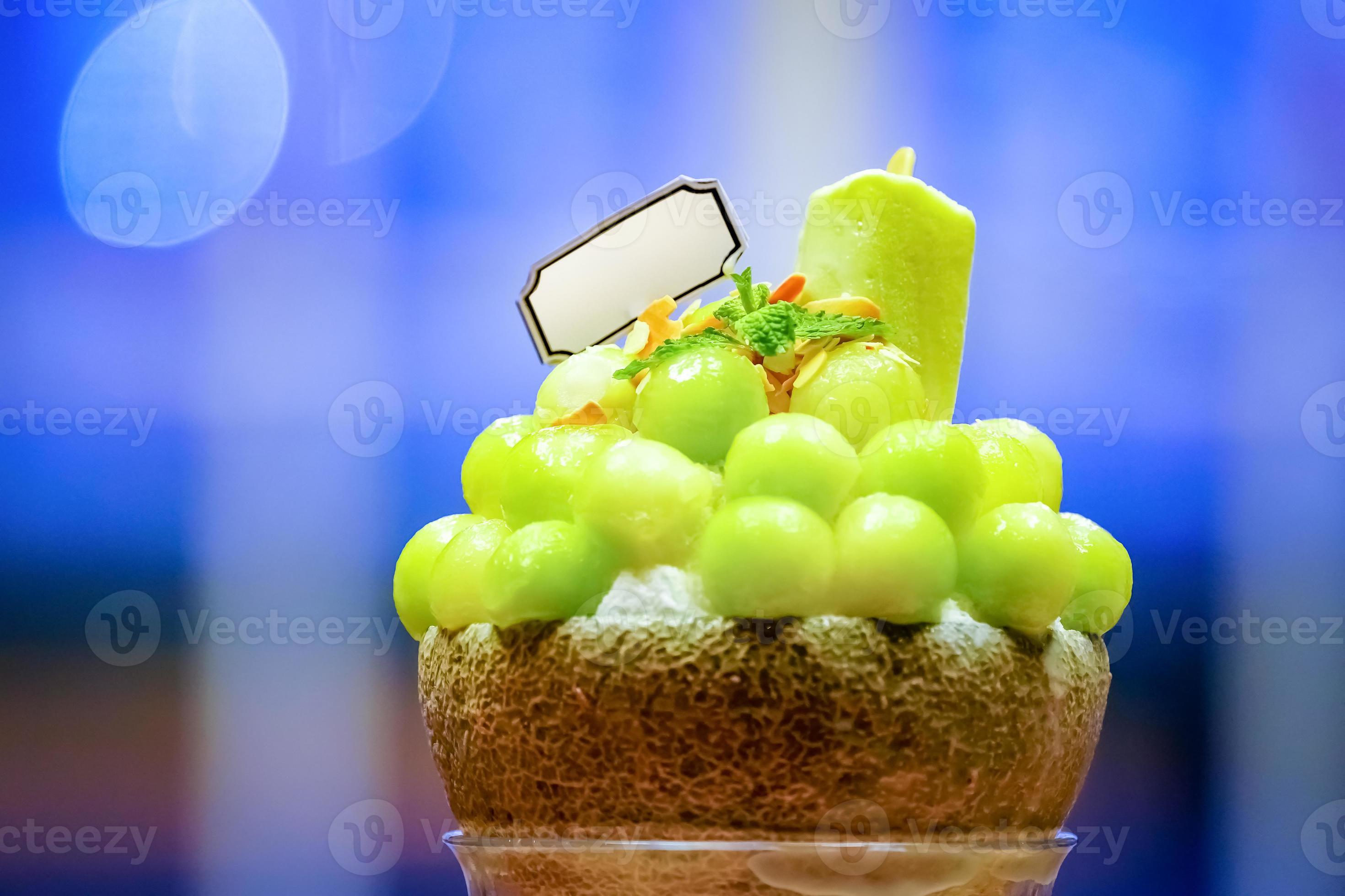 green melon ball shape are arranged on the top of bingsu korean icecream style and decorated